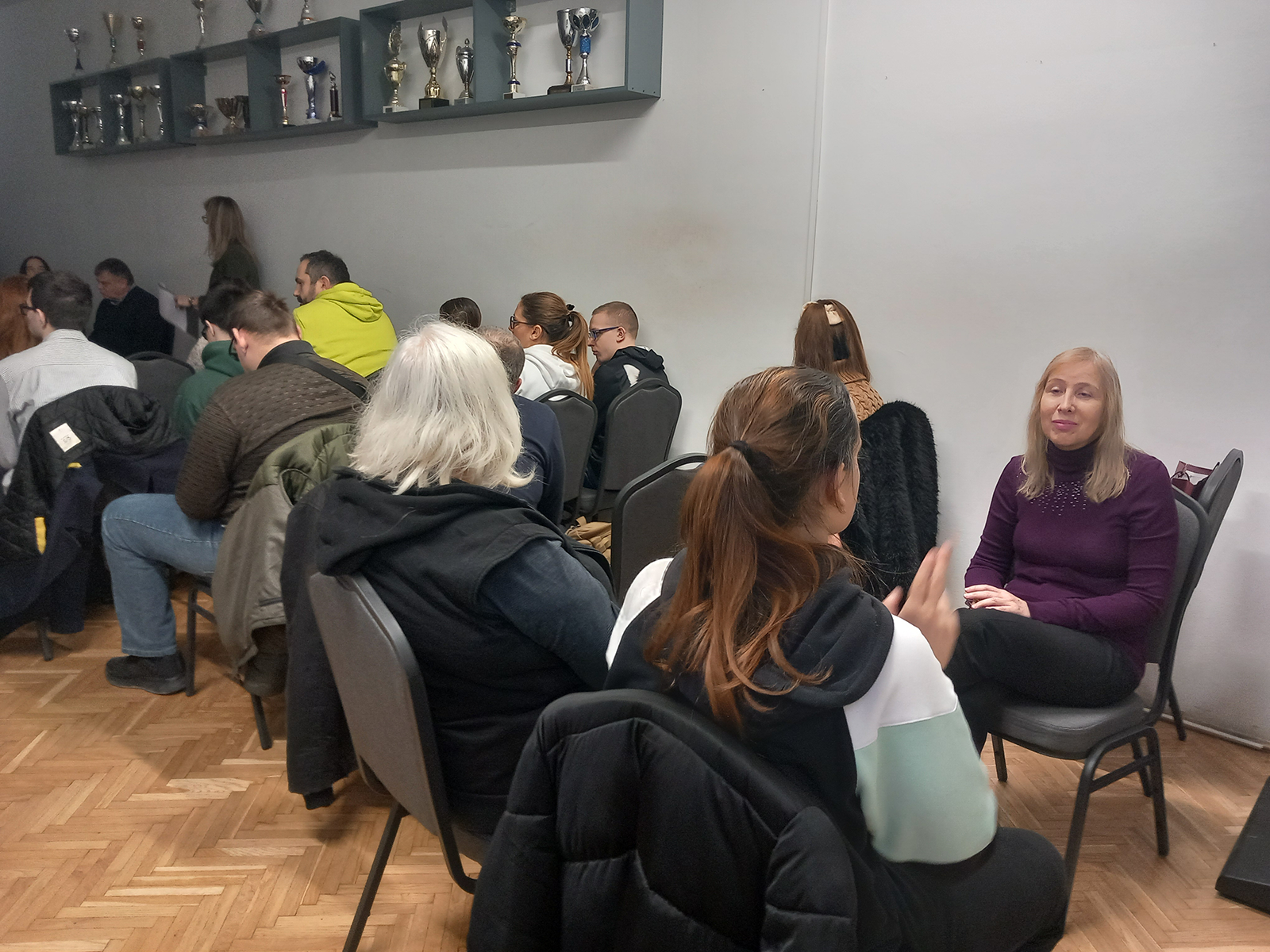 Group discussion with participants sitting in a smaller room.